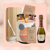 Entertainment Delight gift set with 50g bag of nibbles, bamboo cheese board, ceramic serving set, cheese knife, and mini bottle of bubbles, perfect for engagements, weddings, corporate thank you, and corporate house settlement gifts.