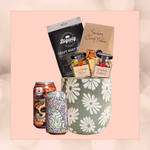 Beers & Bites gift set in an eco-friendly plant pot, featuring craft beers, nibbles, and antipasto, wrapped in sustainable materials."