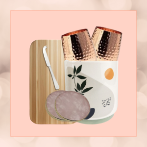 Entertainers Ensemble gift set in an eco-friendly plant pot, featuring a bamboo cheese board, cheese knife, copper stemless wine glasses, and crystal coasters, wrapped in sustainable materials."