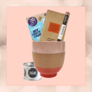 Pantry Starter Kit in an eco-friendly plant pot, featuring Byron Bay coffee, artisan cookies, Teassentials tea, and stylish pantry labels, wrapped in sustainable materials."